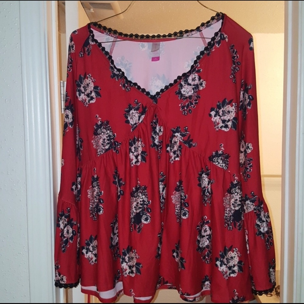 Black and red shirt with bell sleeves.